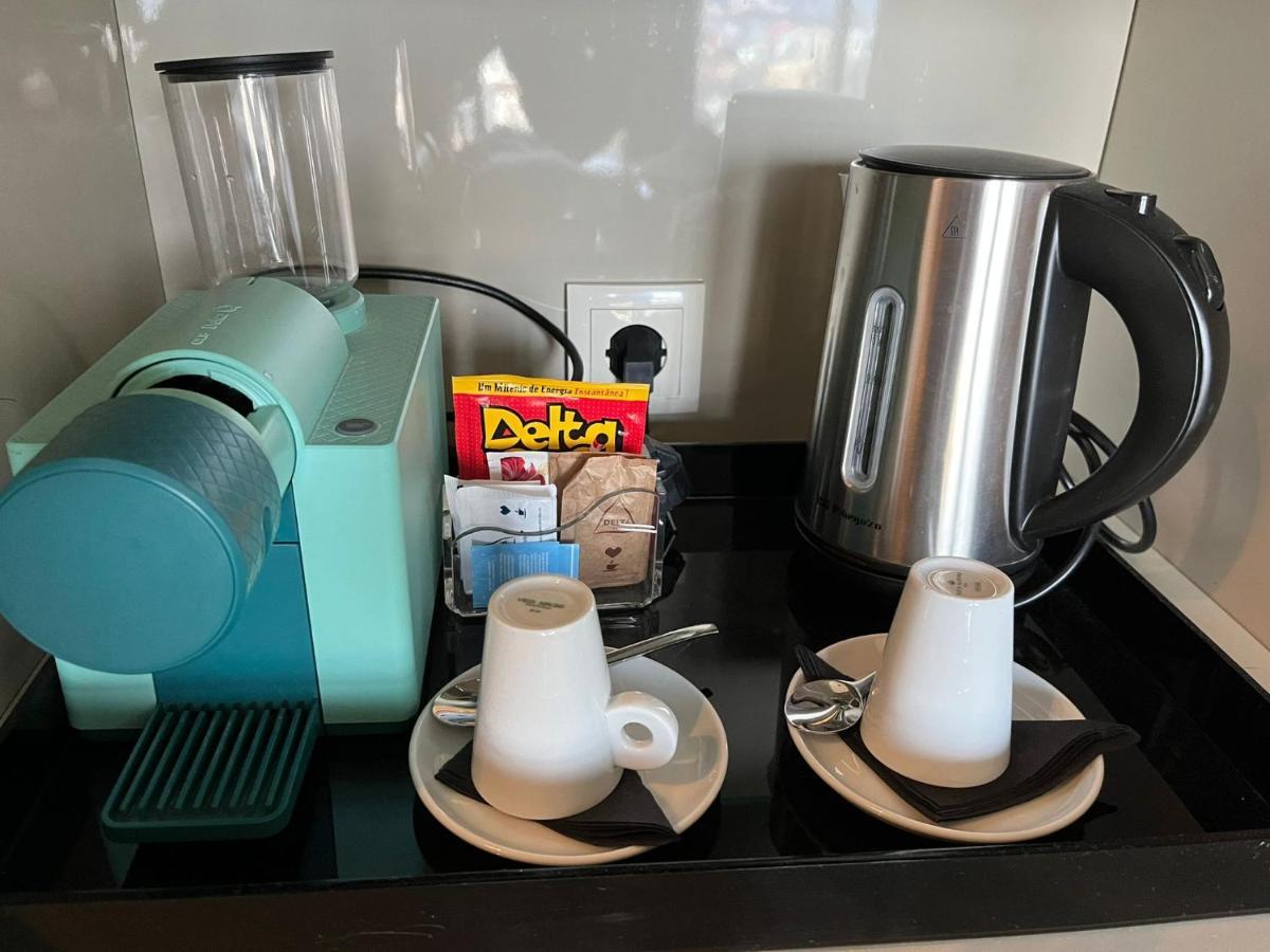 Melia Braga Hotel & Spa Экстерьер фото A Nespresso coffee machine in a hotel room