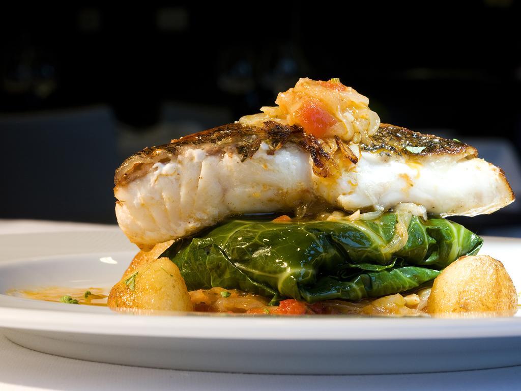 Melia Braga Hotel & Spa Экстерьер фото A prepared dish of halibut
